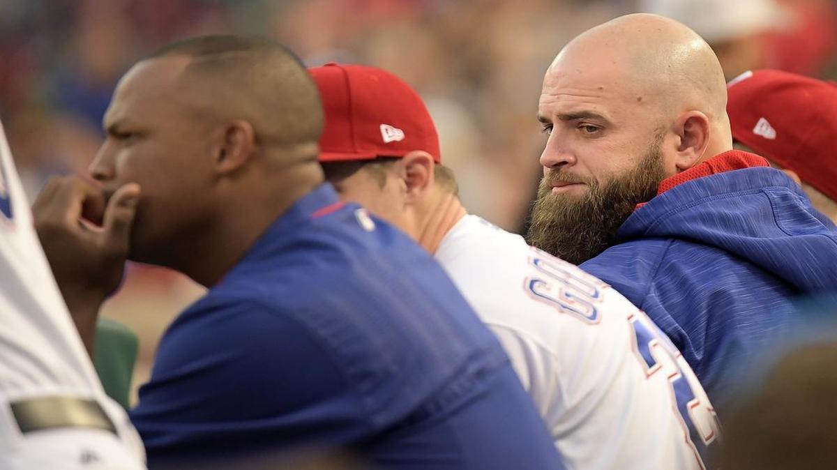 Rangers first baseman Mike Napoli, right, watches Wednesday’s game from the bench. Adrian Beltre, left, pinch-hit in the sixth.