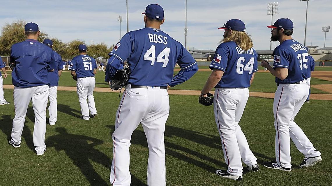Tyson Ross, left, with A.J. Griffin and Cole Hamels during spring training, could make his Rangers’ debut Friday night against the Mariners at Globe Life Park.