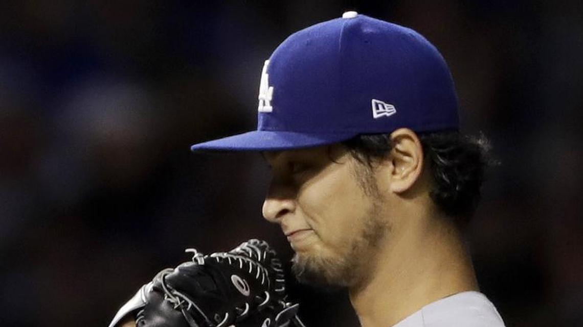 Dodgers starting pitcher Yu Darvish reacts after giving up a home run during the first inning of Game 3 of the NLCS against the Chicago Cubs Tuesday night at Wrigley Field.