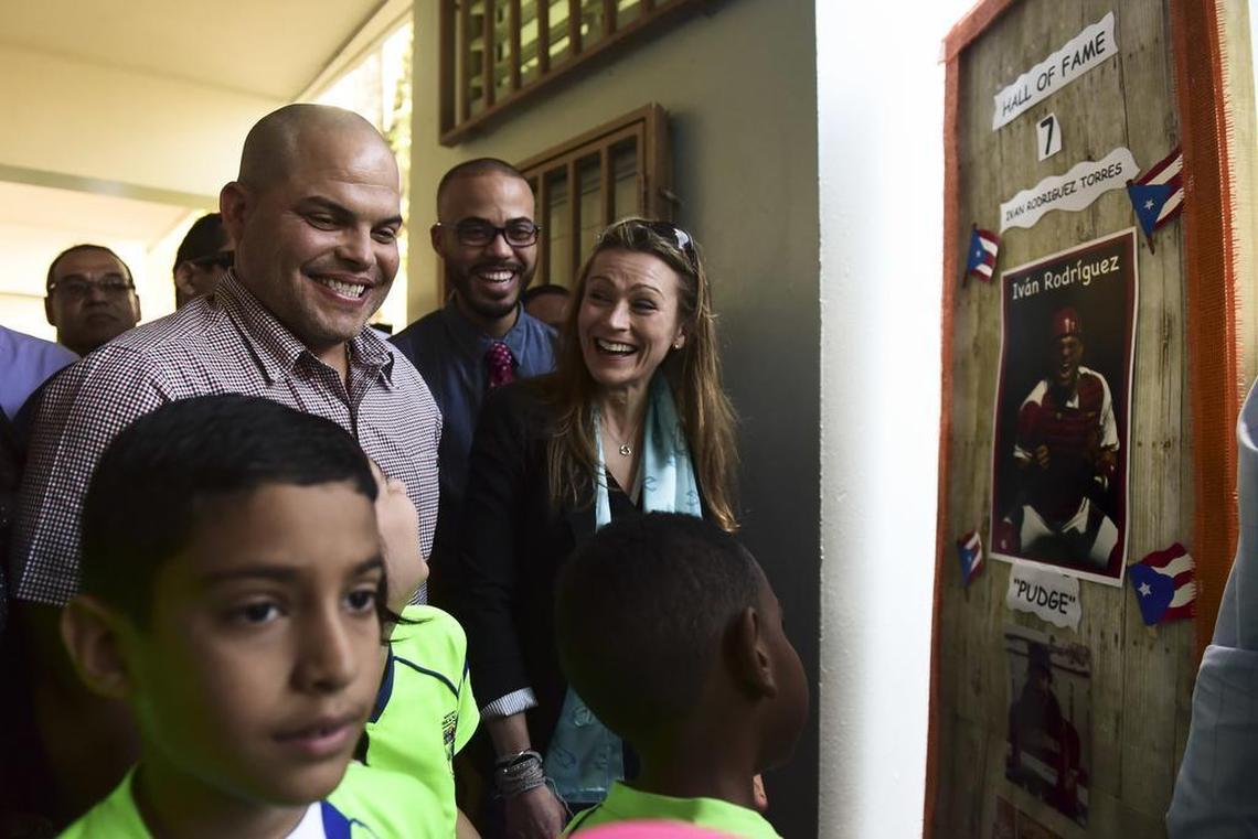 Andres Waldemar, Recreation and Sports Department secretary and Education Department secretary Julia Keleher, accompany Pudge Rodriguez, who was received in his hometown school, José Gualberto Padilla Elementary, in Vega Baja, Puerto Rico, Friday, Jan. 27. Rodriguez is the fourth native Puerto Rican inducted into the Baseball Hall of Fame and is the youngest inductee at 45.
