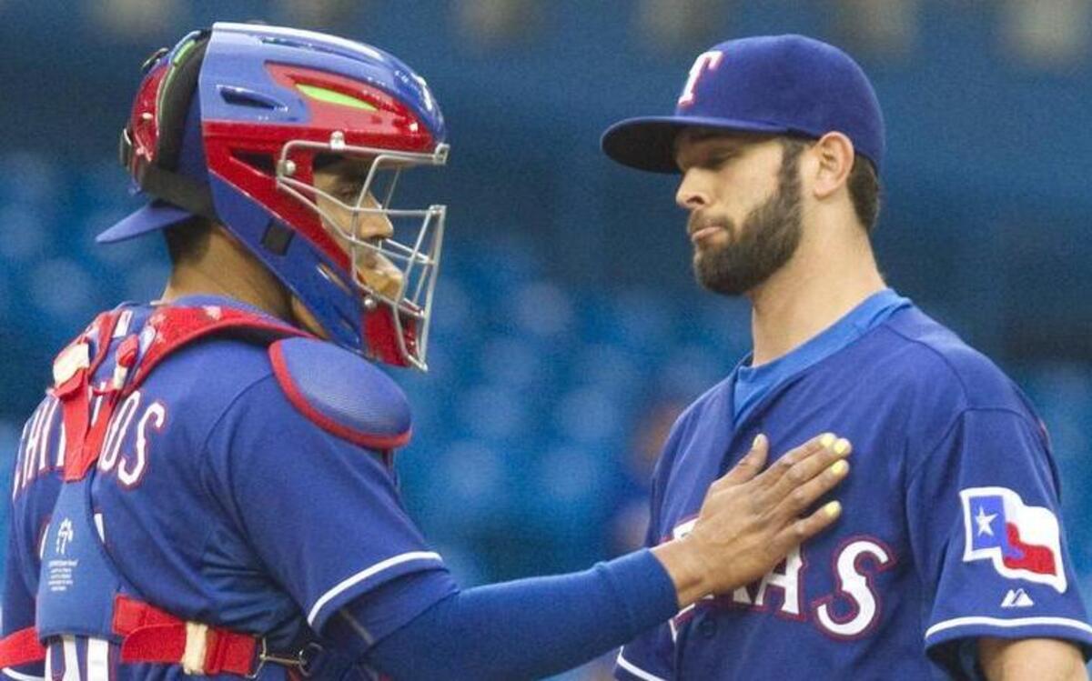 
Rangers catcher Robinson Chirinos tries to settle starter Nick Martinez, who allowed nine runs in six innings.


