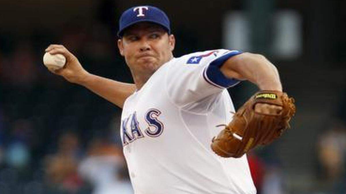 
The Rangers’ Colby Lewis performed well in the second half of 2014.



