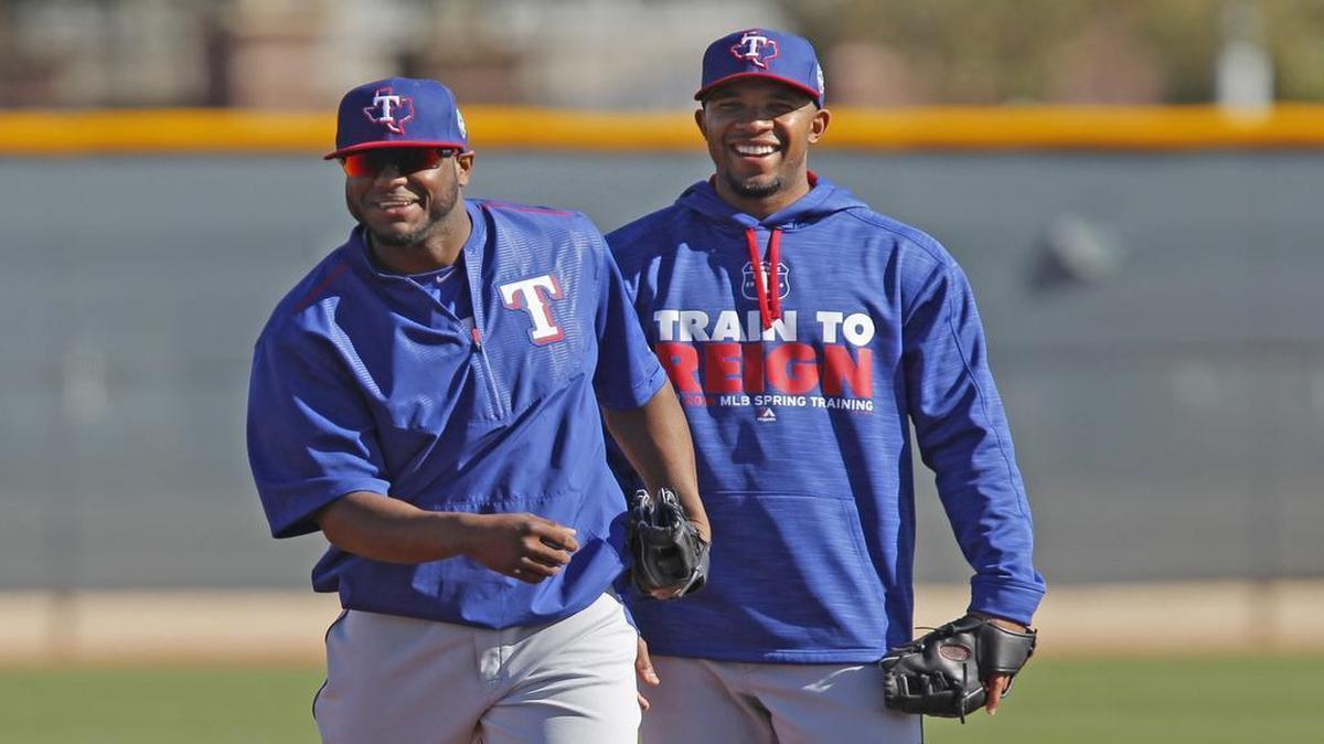 Rangers utility infielder Alberto Hanser, left, with Elvis Andrus, is vying for a roster spot against veteran Pedro Ciriaco.