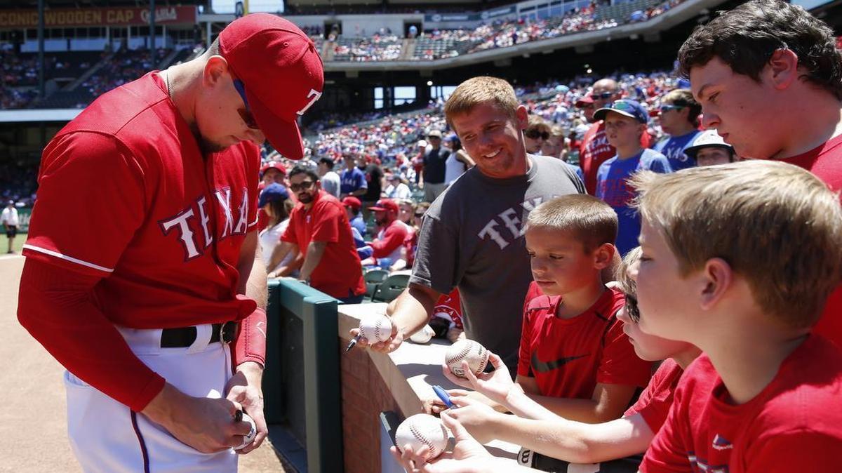 Ryan Rua signs autographs for fans before a game in early June. Rua is batting .278 with seven homers and 19 RBI in 57 games.