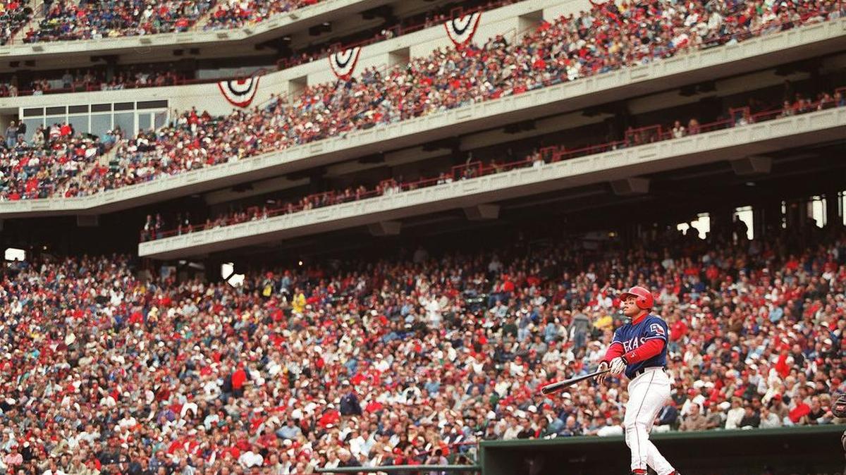 Texas Ranger catcher Ivan Rodriguez watches his three-run home run in the third inning of season opener against the Chicago White Sox in 2000.