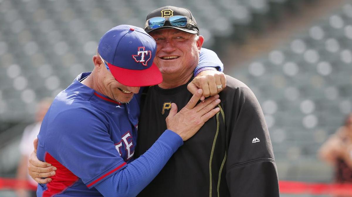 Rangers manager Jeff Banister, left, and Pittsburgh Pirates manager Clint Hurdle, right, meet during batting practice before Friday’s game. Banister was a coach under Hurdle from 2011 to 2014.