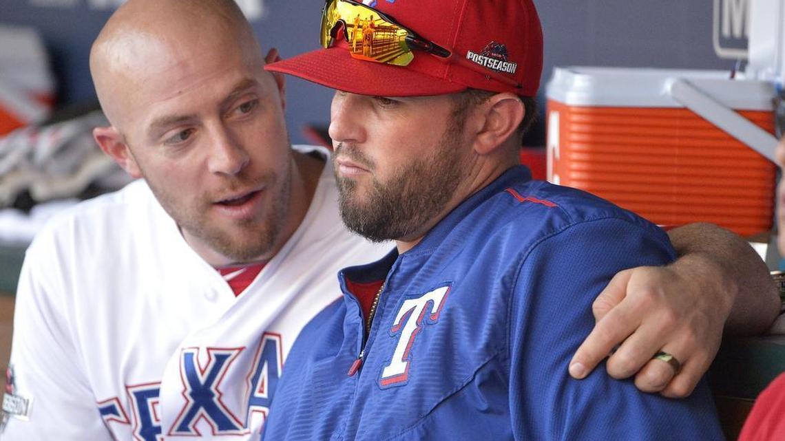 Rangers catcher Chris Gimenez, left talks with catcher Bobby Wilson during a playoff game in October. Wilson was reacquired in a trade with the Tigers Tuesday and Gimenez was designated for assignment.