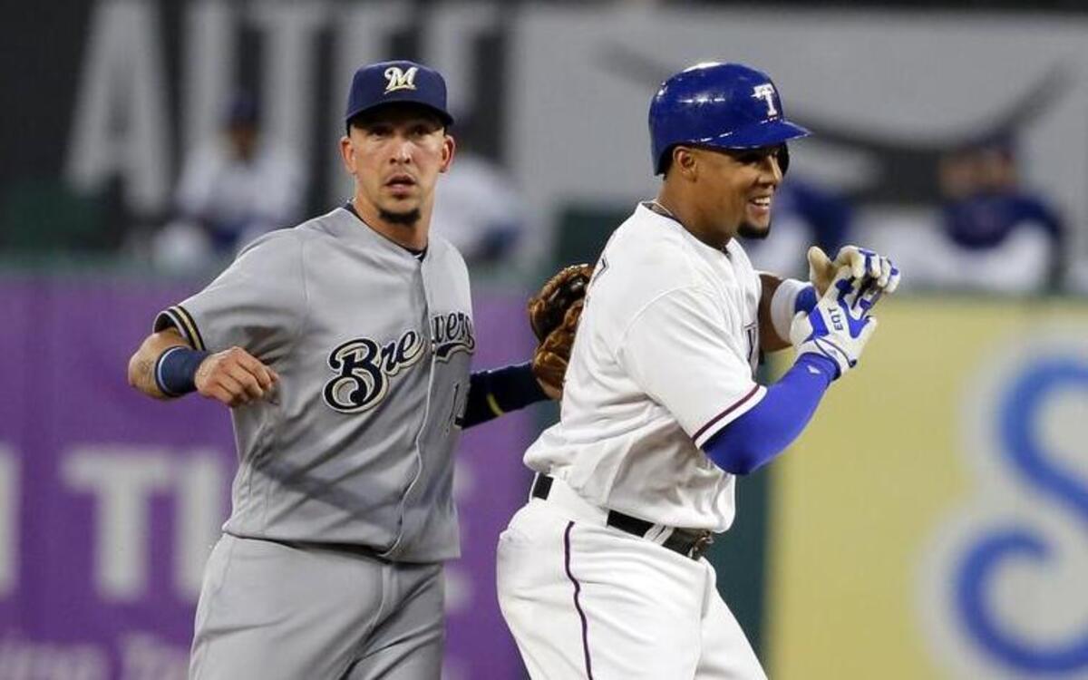 Carlos Gomez, right, with a leadoff double Wednesday against center fielder Hernan Perez and the Brewers, likely would move to the No. 8 spot in the Rangers’ lineup when Shin-Soo Choo returns.