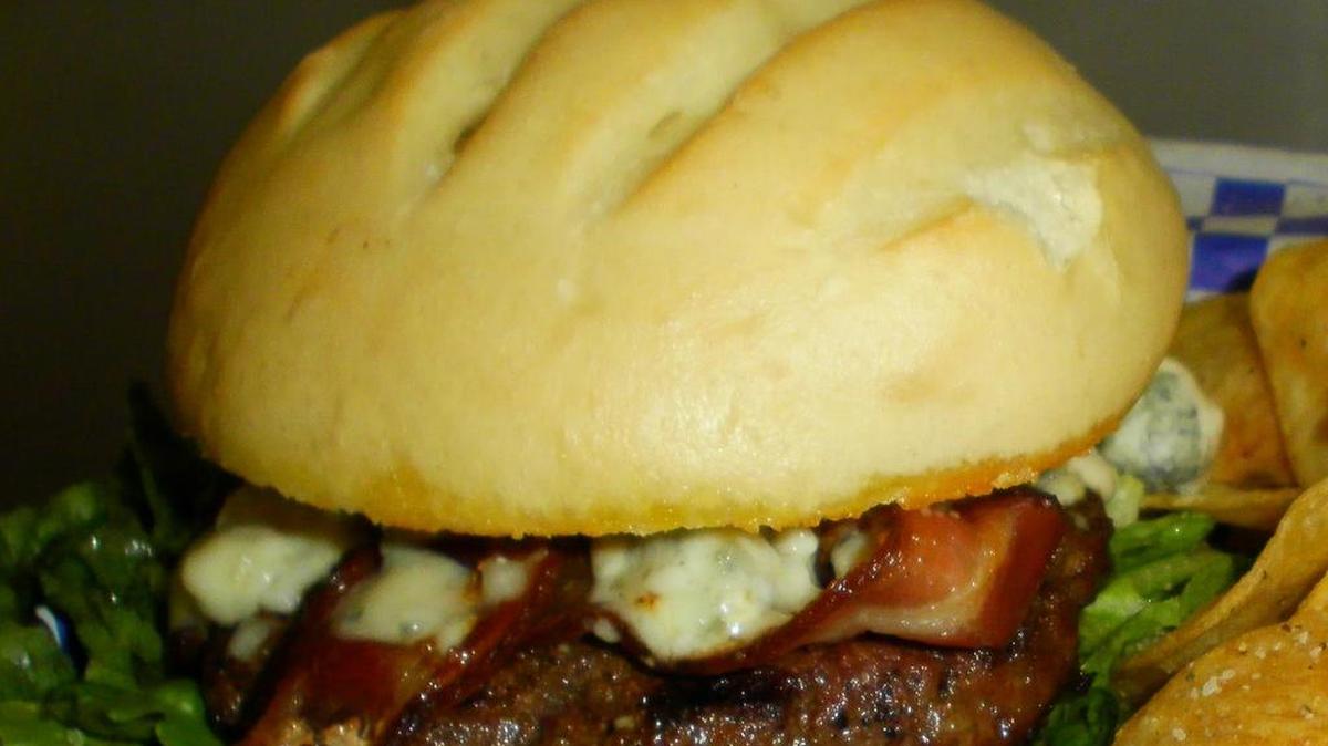 The Too Bleu Bacon Burger at Booty’s in Surprise, Ariz., comes with melted bleu cheese, applewood smoked bacon and bleu cheese dressing.