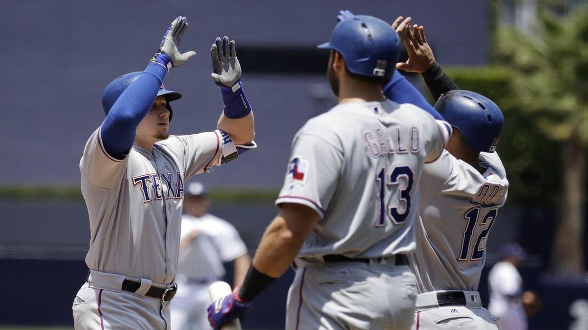 Ryan Rua, left, hit a three-run homer in the first inning Tuesday that was part of a big day for the offense, including for Joey Gallo and Rougned Odor.