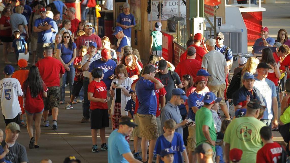 Fans wait in the concession line at the Rangers’ ballpark in Arlington.