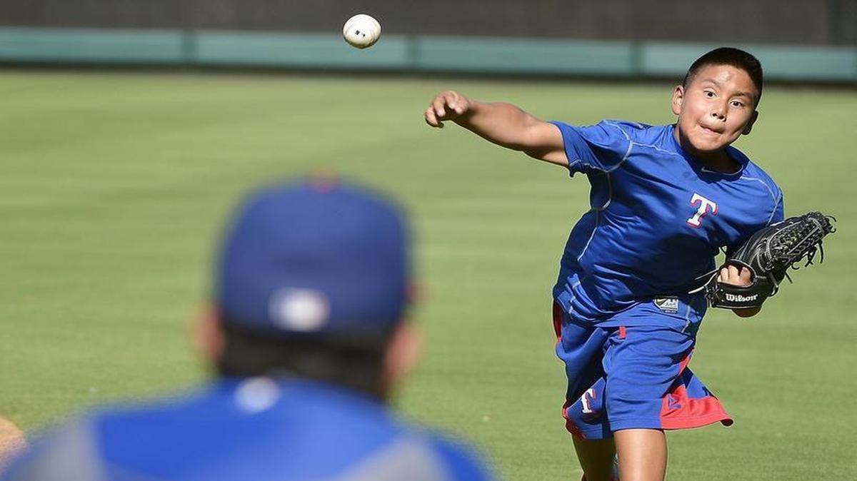 
Rangers pitcher Yovani Gallardo, who grew up in Fort Worth and lives near Eagle Mountain Lake, plays catcher for his son Yovani Gallardo, Jr., before Tuesday’s game with the Yankees at Globe Life Park.

