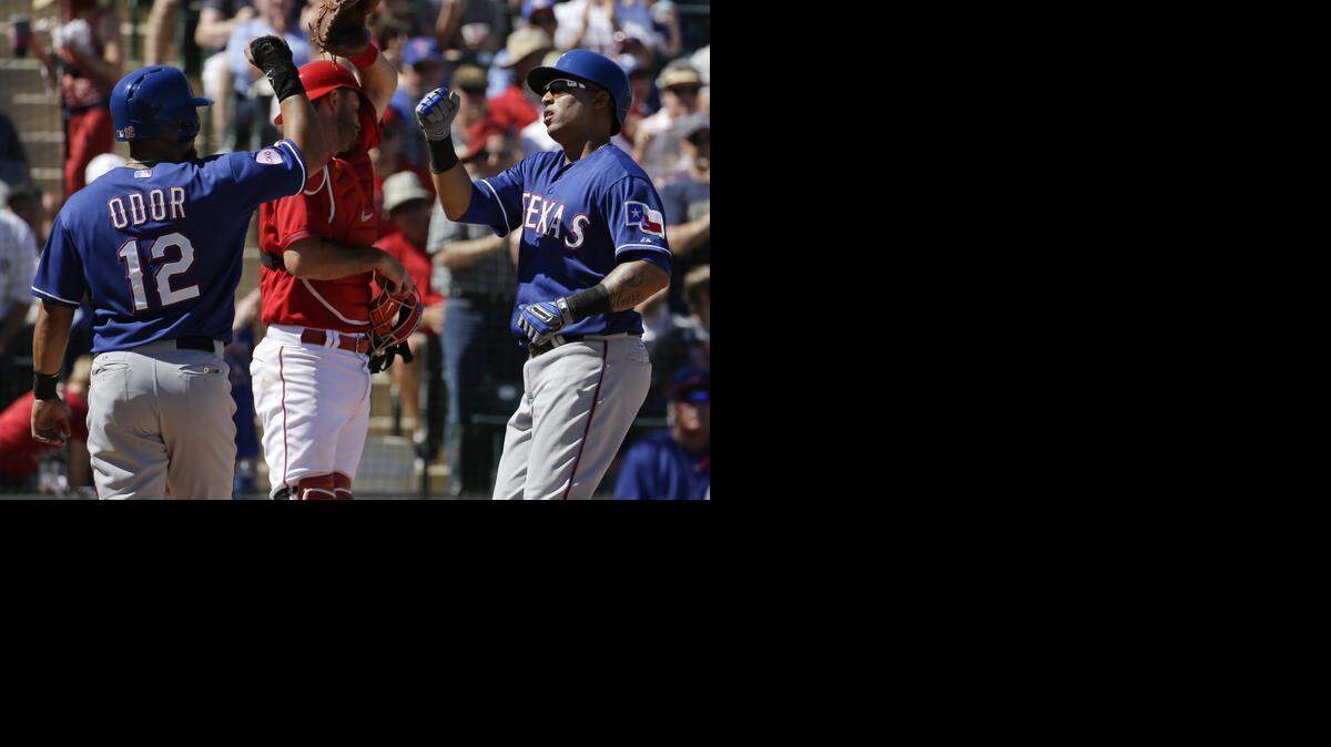 
Leonys Martin, right, celebrates his two-run home run in the third inning Tuesday with Rougned Odor.


