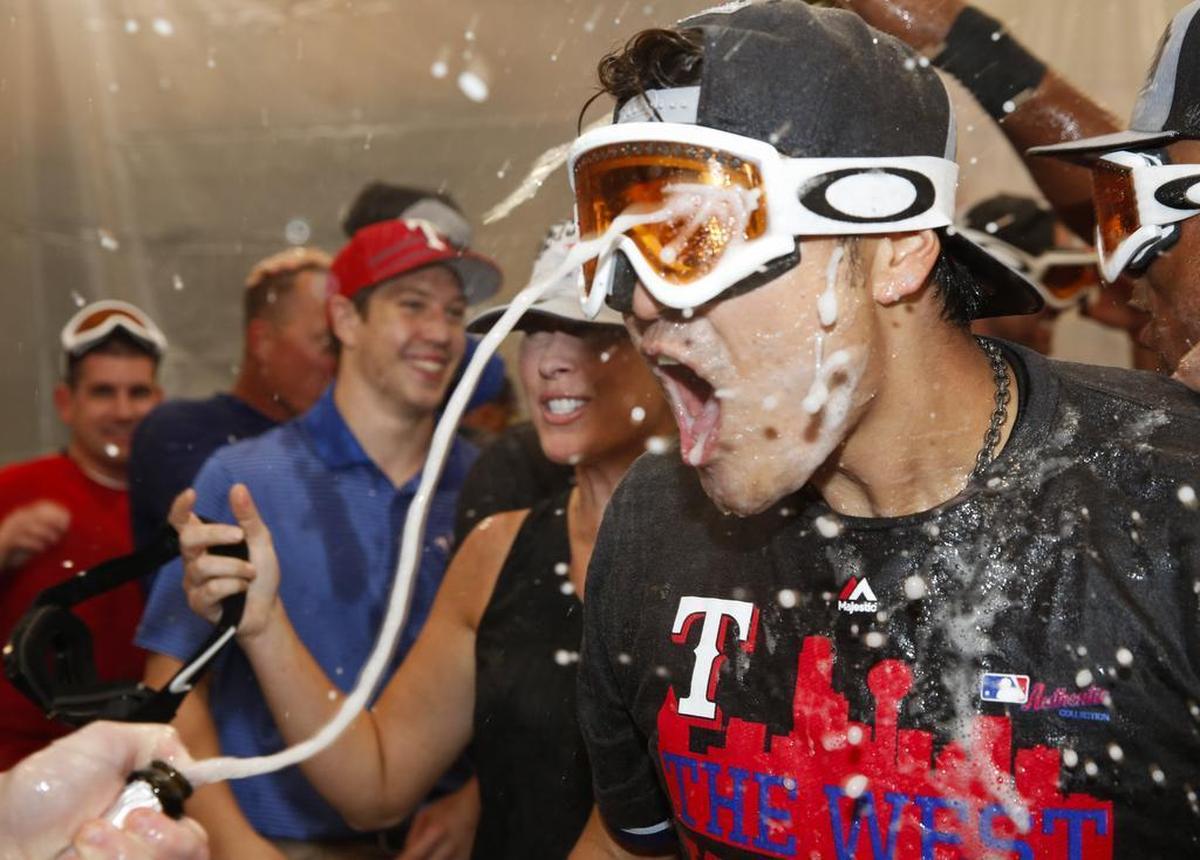 Shin-Soo Choo celebrates in the clubhouse following the Rangers’ 9-2 win over the Angels on Sunday afternoon at Globe Life Park.