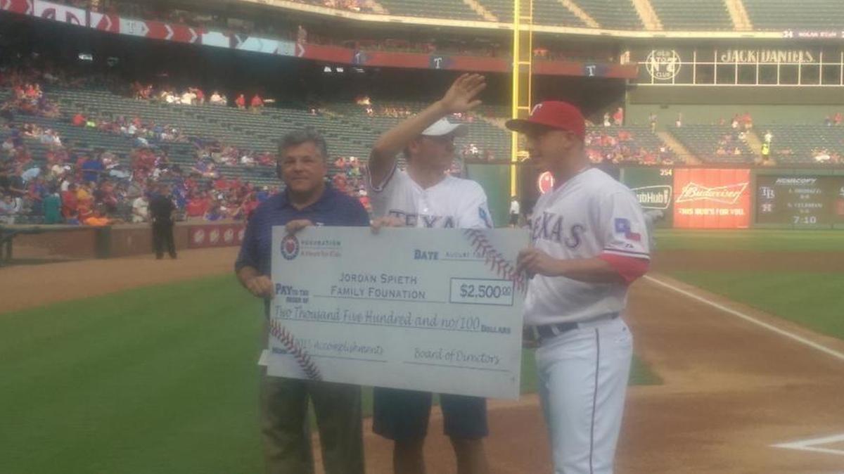 
The world’s No. 1-rated golfer and Dallas resident Jordan Spieth poses with Rangers pitcher Derek Holland, right, and the Rangers’ Ownership committee chairman Neil Liebman.

