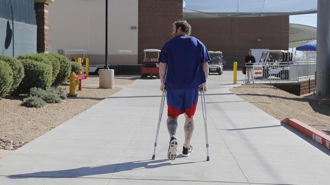 Josh Hamilton walks back on crutches at Rangers spring training in February in Surprise, Ariz. Hamilton likely will not return to the Rangers and maybe not to baseball after he has surgery on his left knee June 8.
