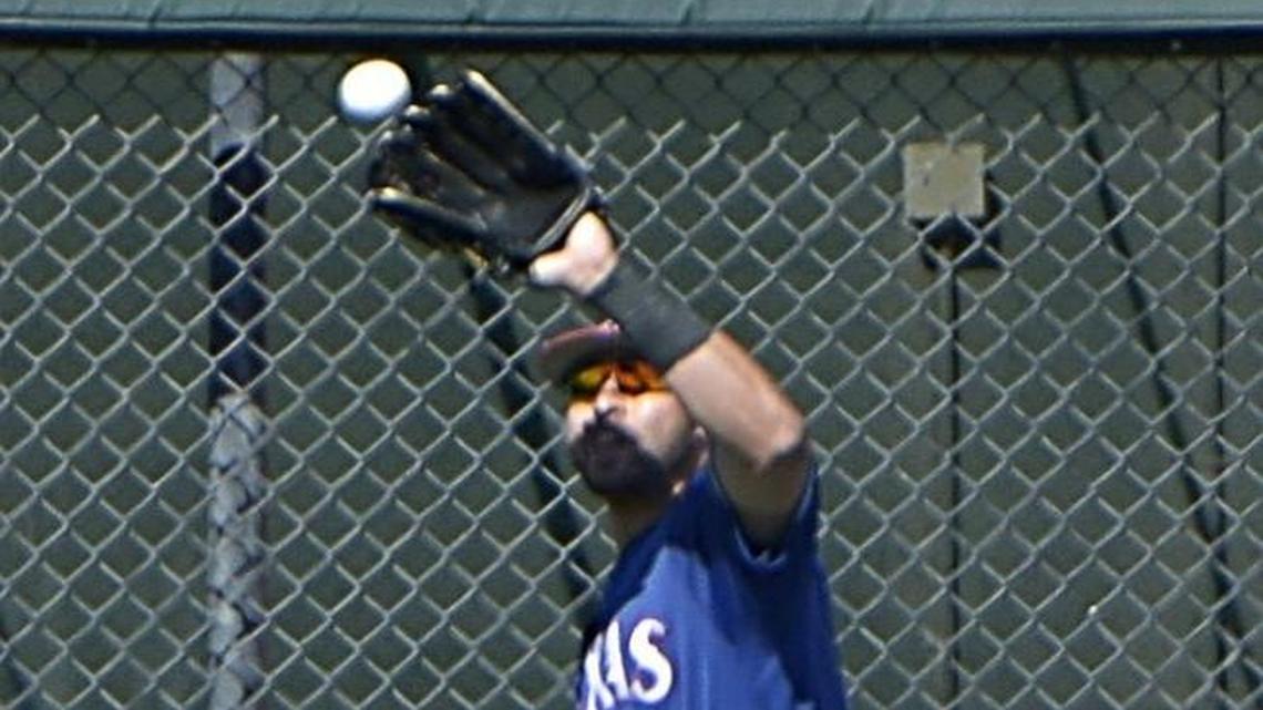 Joey Gallo had to battle the sun Saturday while running down a flyball. The slugger said that he enjoys playing the outfield.