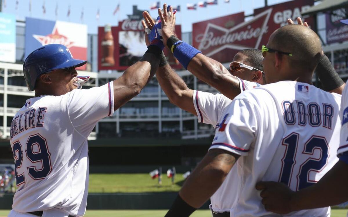
Adrian Beltre, left, celebrates his two-run home run with Elvis Andrus and Rougned Odor (12) in the fourth inning Sunday at Globe Life Park. Beltre had two homers and five RBI in the Rangers’ 9-4 win against the Athletics.
