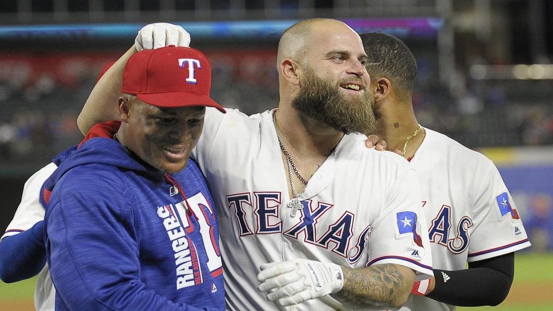 Mike Napoli, right, with Adrian Beltre, left, was back in the lineup Friday night after missing nine games with a lower back strain, along with Carlos Gomez, who has been on the disabled list since May 16 with a right hamstring strain.