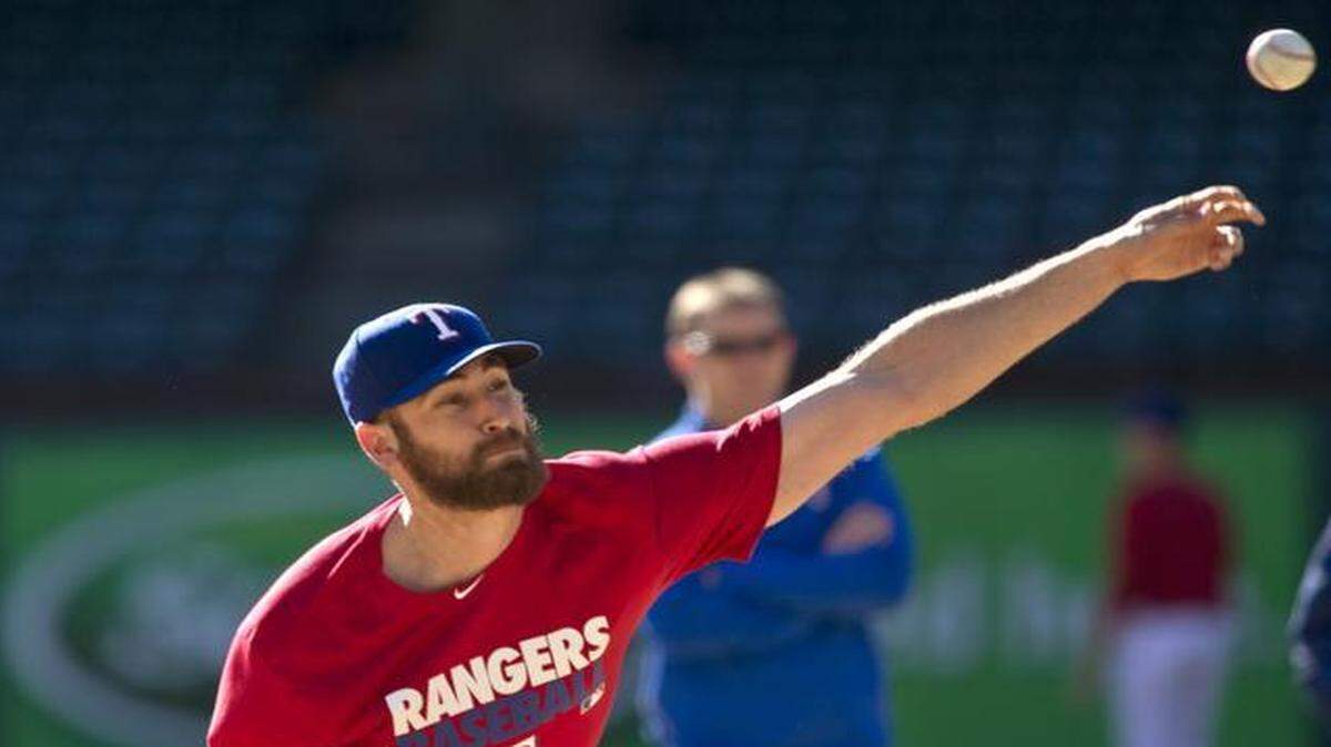 
Rangers left-handed relief pitcher Michael Kirkman will miss a few days of spring training after suffering soreness in his throwing shoulder after the club’s first workout on Saturday.
