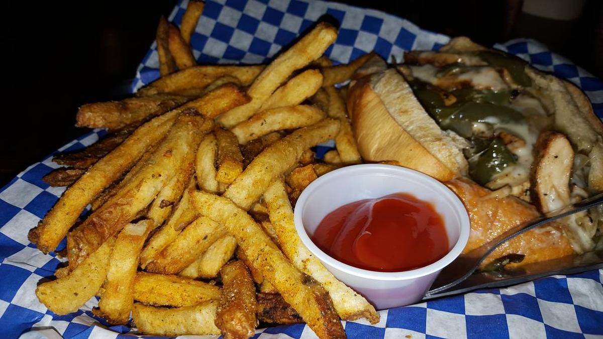 The fries at Booty’s Wings, Burgers and Beer, a sports bar near the Rangers’ spring training complex in Surprise, Ariz., are fresh cut daily and fried in soy oil. Here they compliment Booty’s chicken bomber.