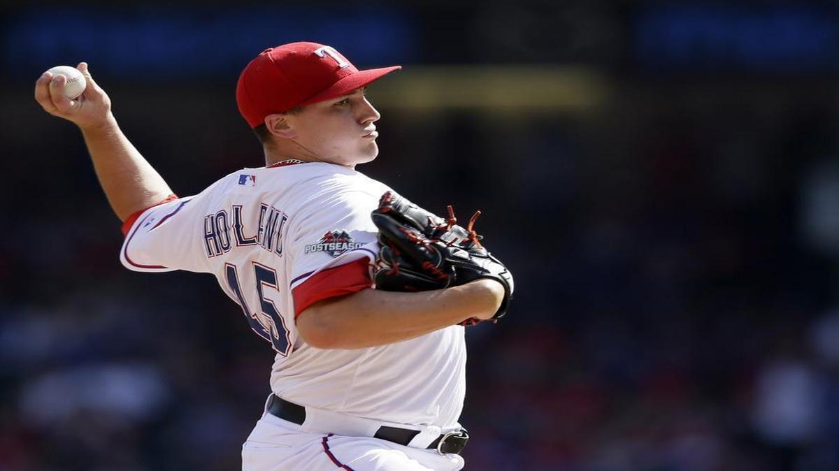 
Rangers starter Derek Holland allowed three runs in the first inning. 
