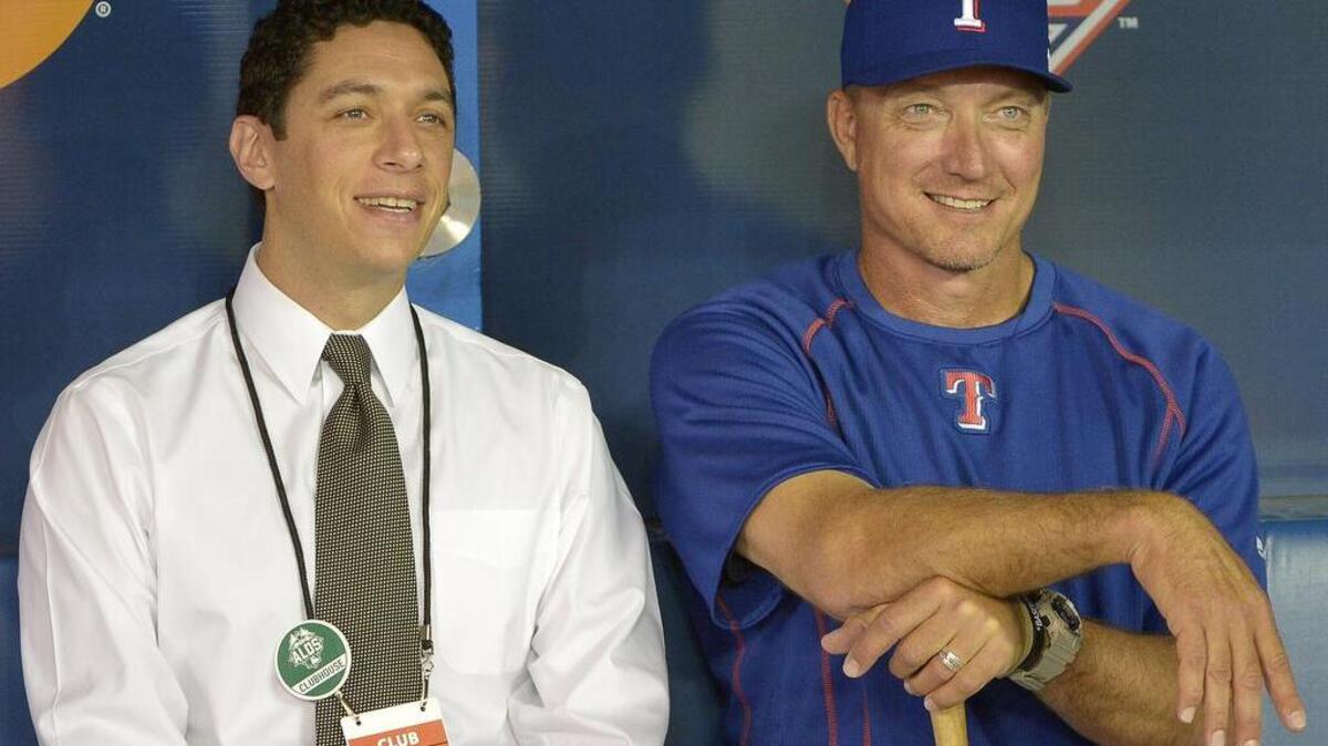 Rangers general manager Jon Daniels, left, and manager Jeff Banister are part of the Ultimate Rangers Experience, which fans can bid on through Thursday at mlb.com.