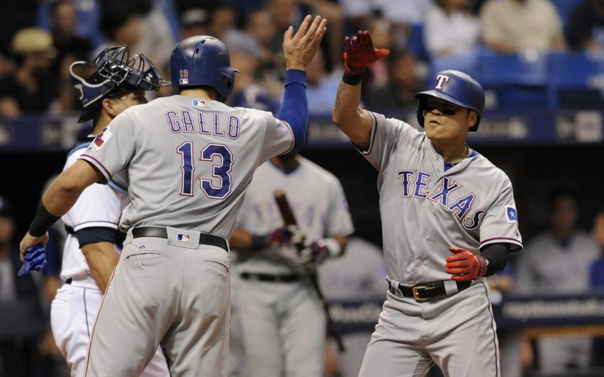 Joey Gallo, left, congratulates Shin-Soo Choo after scoring on Choo’s two-run home run in the ninth inning Friday night.