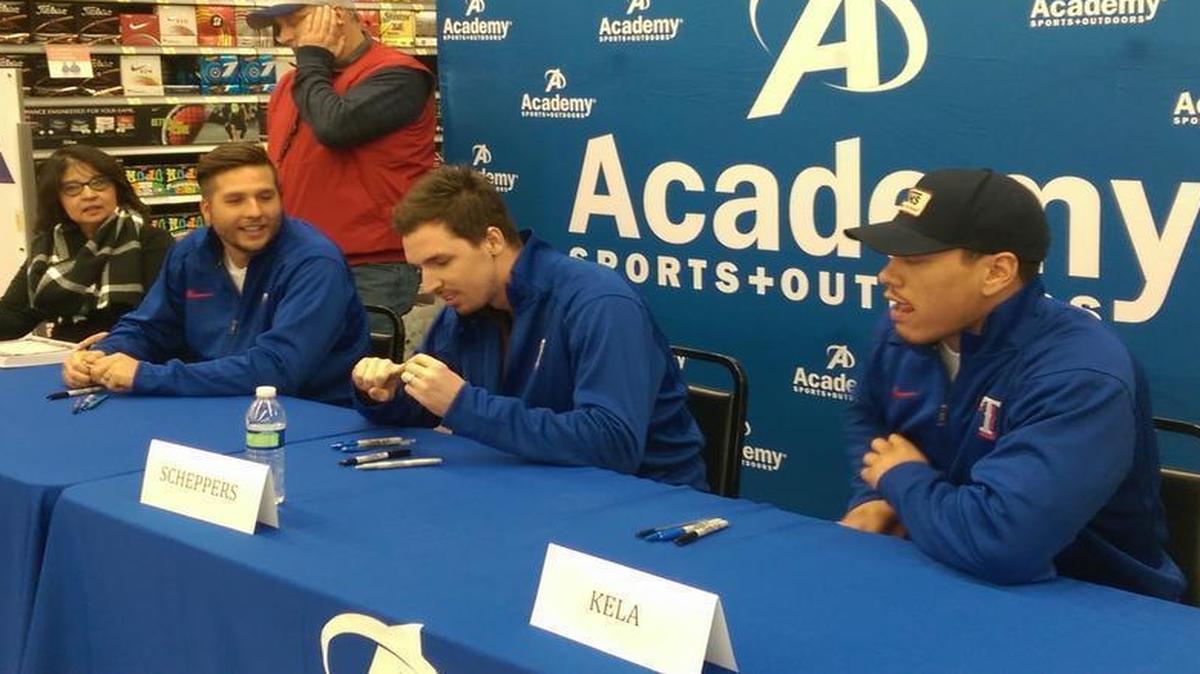 Rangers pitchers, from left, Shawn Tolleson, Tanner Scheppers and Keone Kela prepare to sign autographs at the first edition of the Rangers’ winter caravan at an Academy store in Frisco on Friday night.