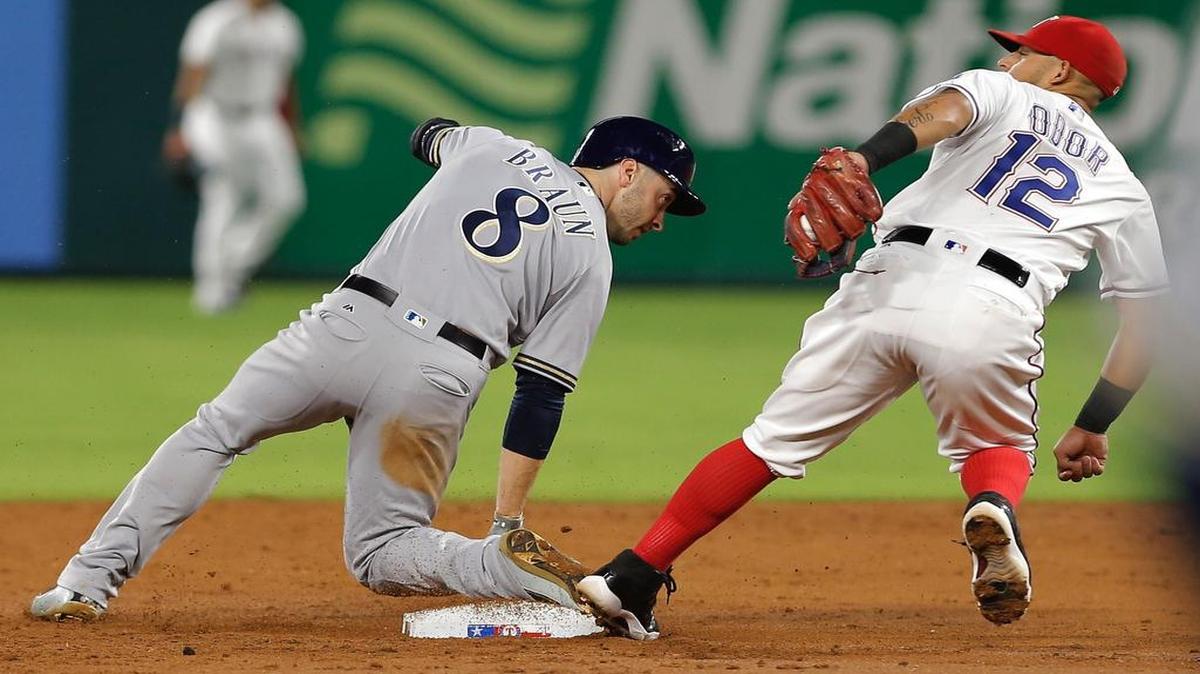 Rougned Odor tags out the Brewers Ryan Braun on a steal attempt in the third inning Monday night. The Brewers beat the Rangers 8-3 at Globe Life Park.