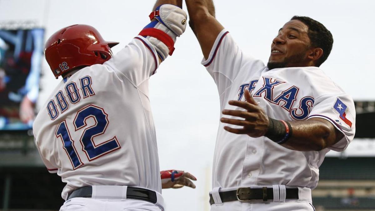 
Rangers’ Rougned Odor, left, celebrates his solo home run with Elvis Andrus against the Blue Jays in the second inning Tuesday at Globe Life Park. Toronto beat Texas 6-5 with two runs in the 9th.
