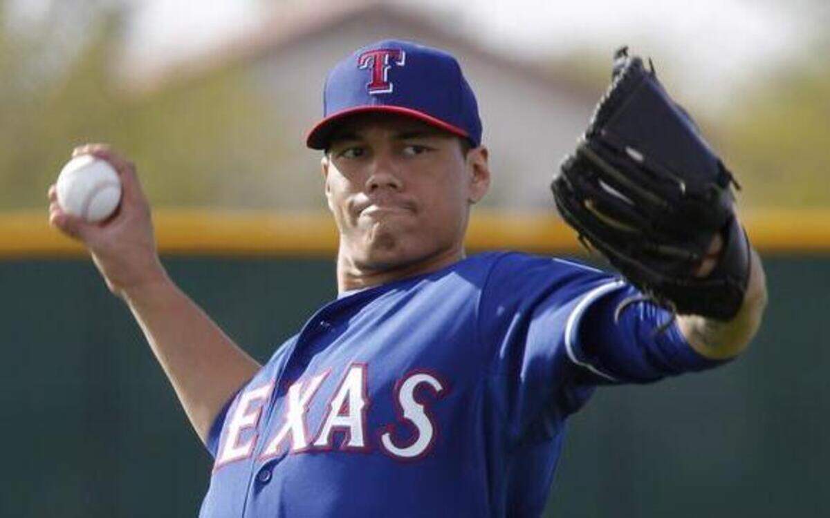
Rangers pitching prospect Keone Kela works out on the first day of his first major league spring training.
