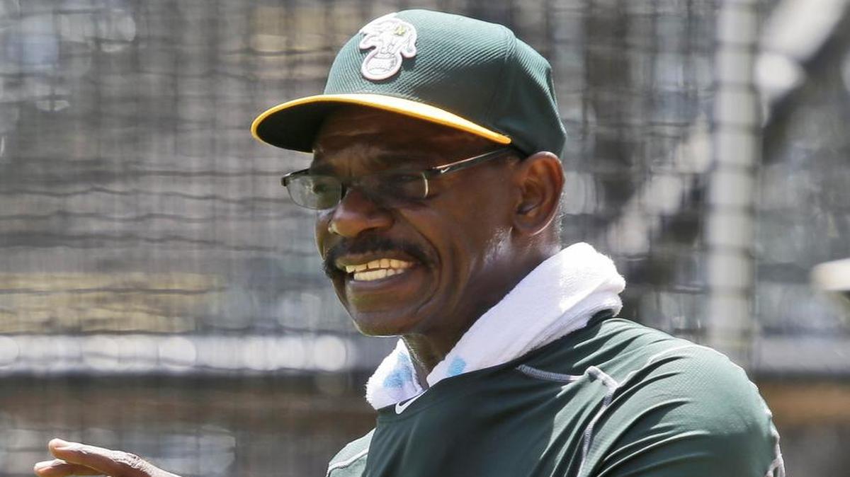 In this June 23, 2015, file photo, Oakland Athletics fielding coach Ron Washington gives instructions during a pre-batting practice workout before a baseball game against the Texas Rangers in Arlington, Texas.