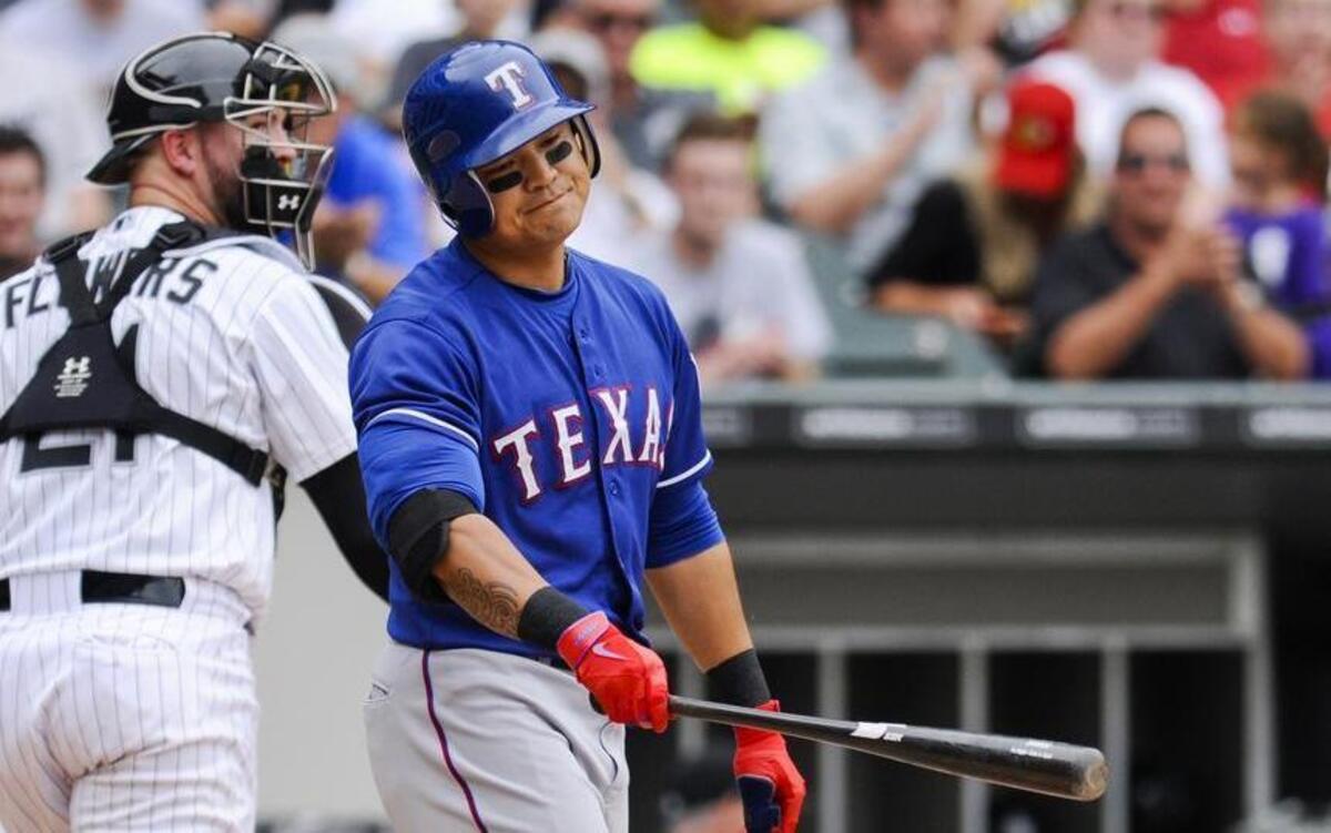 
Rangers right fielder Shin-Soo Choo reacts as he is called out on strikes as White Sox catcher Tyler Flowers watches during the fifth inning Saturday.
