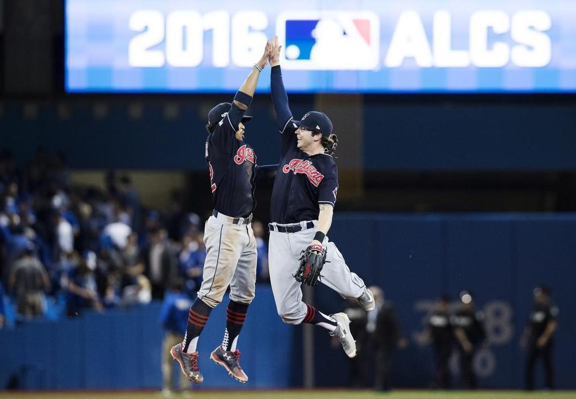 Indians shortstop Francisco Lindor, left, and centre fielder Tyler Naquin celebrate after clinching the American League pennant. Naquin played at Klein Collins High School and Texas A&M.