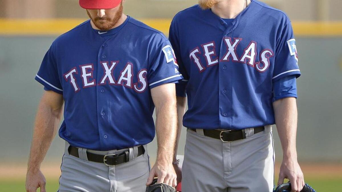 Trade acquisitions Sam Dyson, left, and Jake Diekman added power pitching in late innings for the Rangers in August and September last year.