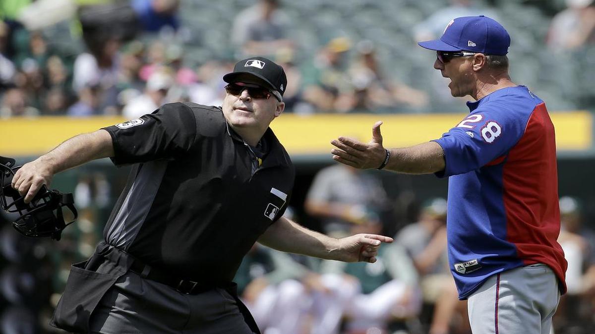 Rangers manager Jeff Banister, right, is ejected by umpire Tim Welke during the third inning of Wednesday’s game at Oakland Coliseum. The Rangers lost to the A’s 9-1 and finished 3-6 on their road trip.