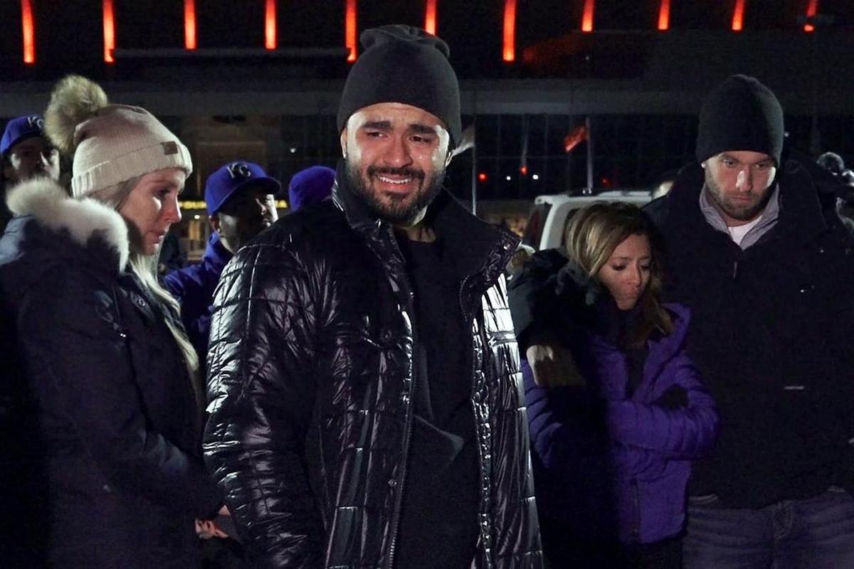 An emotional Christian Colon (center) and Danny Duffy (right) attended a candlelight vigil for Yordano Ventura on Sunday night at Kauffman Stadium.