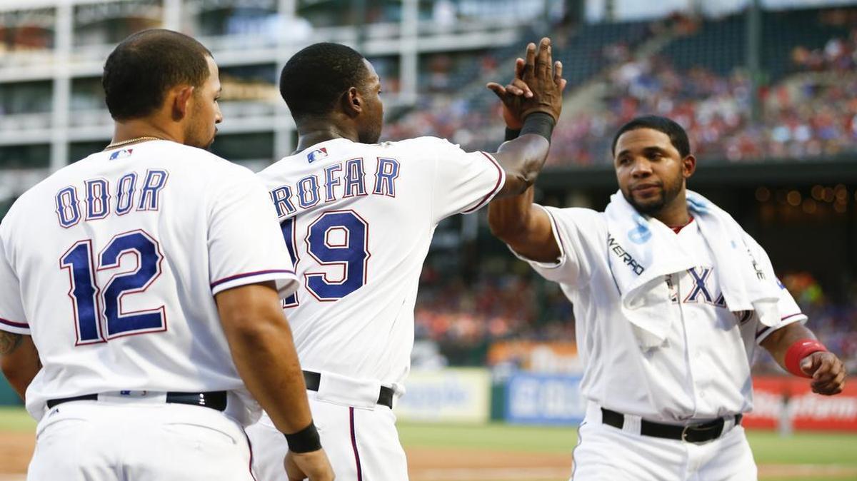 Elvis Andrus, right, celebrates with Jurickson Profar, middle, and Rougned Odor, left, during a game last week. Andrus hasn’t started in 12 games this season and has been playing with a minor groin injury since May.