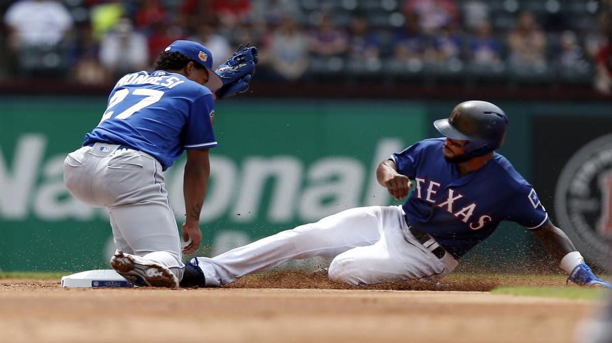 Royals second baseman Raul Mondesi is unable to make the catch on Delino DeShields steal of second base during an exhibition game April 1 at Globe Life Park.