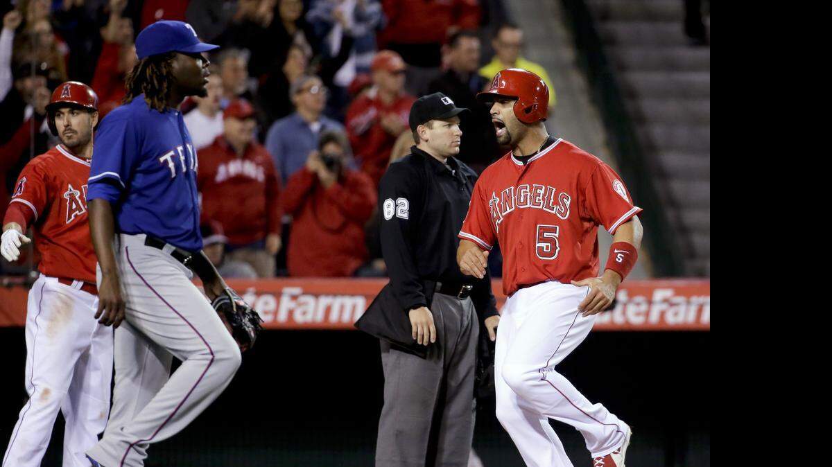 
Albert Pujols scores one of the two runs on C.J. Cron’s single off Roman Mendez in the sixth inning.
