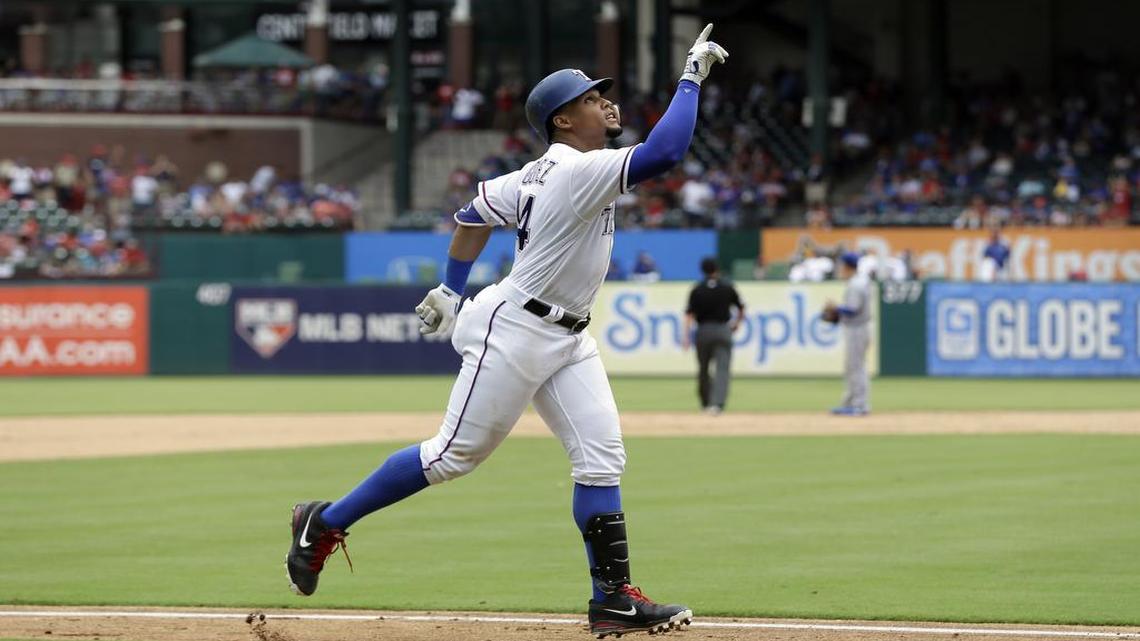Carlos Gomez points skyward as he approaches the plate celebrating his two-run home run, his second of the game, against the Blue Jays Thursday afternoon at Globe Life Park. Gomez tied a career-high with five RBIs in the Rangers’ 11-4 win.