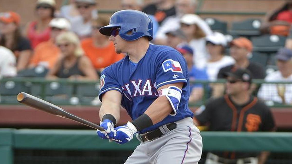 The Rangers looked at Ryan Rua at first base Sunday as the consider how to shape their Opening Day roster.