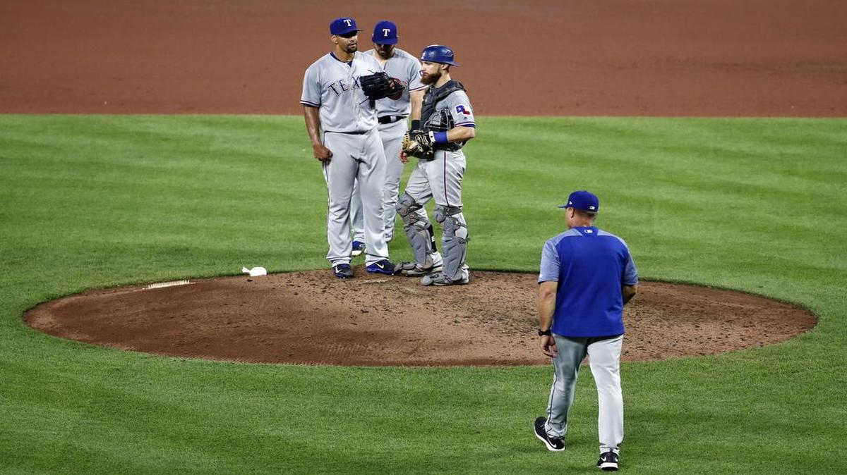 Tyson Ross, left, stands on the mound as he is relieved by manager Jeff Banister, bottom right, in the fourth inning on Tuesday against the Orioles. Ross allowed a season-high eight runs on seven hits, including two homers, in 3 1/3 innings.