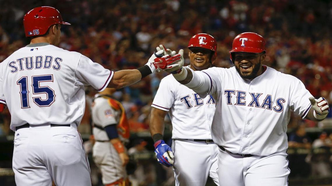 
Prince Fielder celebrates his two-run homer with Drew Stubbs against the Houston Astros during the eighth inning of Monday’s 5-3 win.
