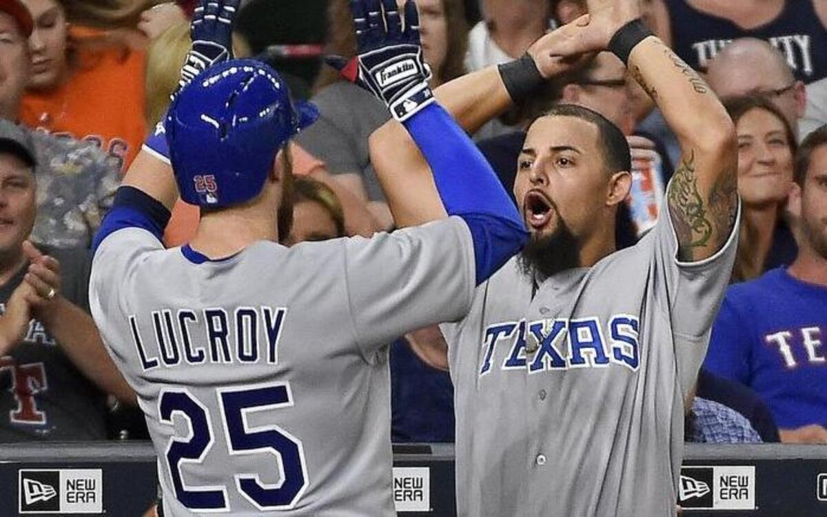 Jonathan Lucroy, left, celebrates hitting a solo home run in the sixth inning Saturday to tie the game at 1-1. Lucroy also homered in the eigth as the Rangers beat the Astros 3-1 at Minute Maid Park.