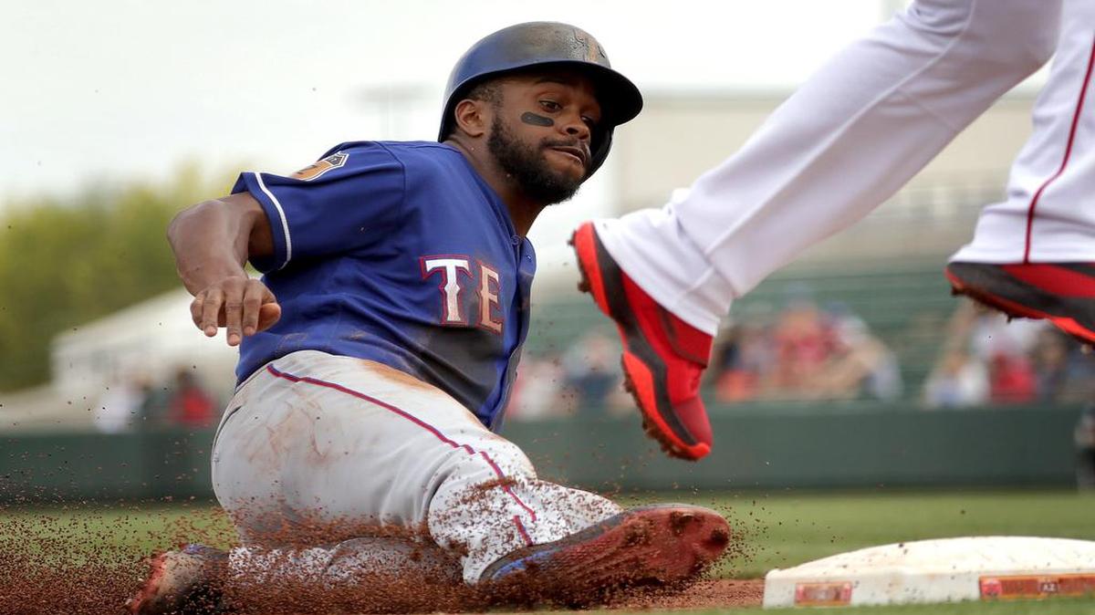 Delino DeShields stole two bases in the first inning Wednesday, including this steal of third base. He’s 9 for 9 in steal attempts this spring. The Rangers beat the Angels 7-4 at Tempe Diablo Stadium Wednesday afternoon.