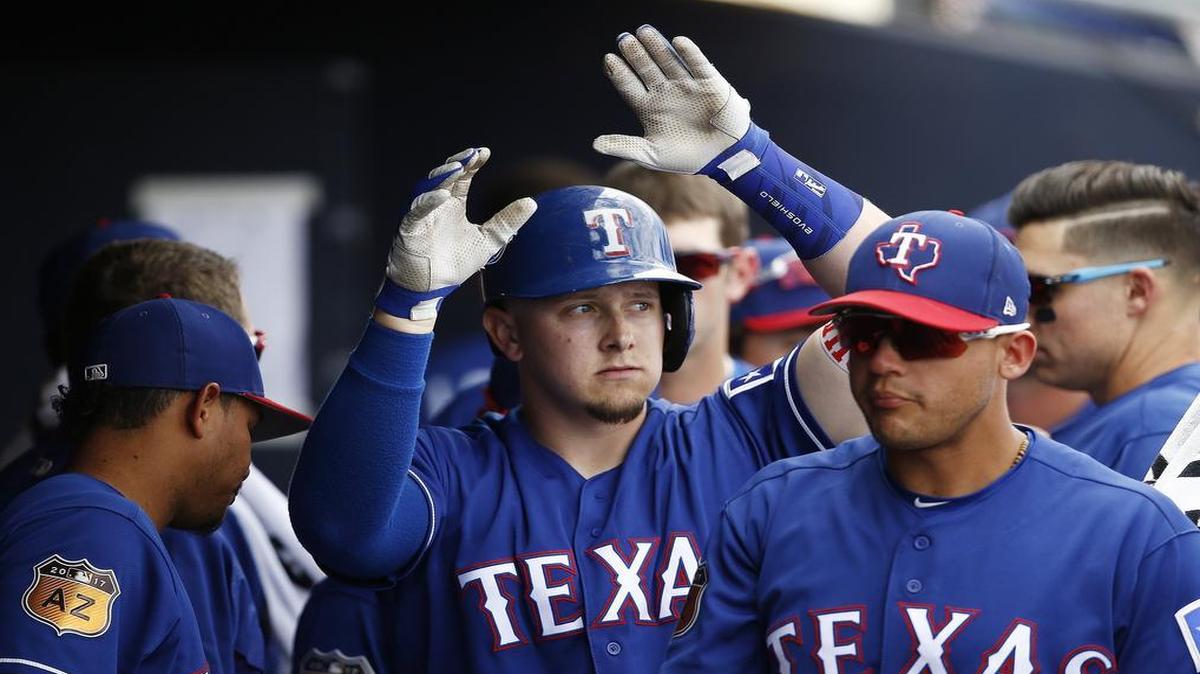 Ryan Rua, middle, celebrates a homer during spring training, a few days before his wife Courtney gave birth to their first child, son Rowan Randy Rua in Ohio in late March. Rua has received daily pictures and video of Rowan through the first week of the season.