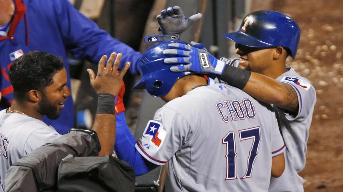 
Shin-Soo Choo (17) celebrates with Rangers teammates Tuesday after completing his cycle with a triple in the ninth inning.


