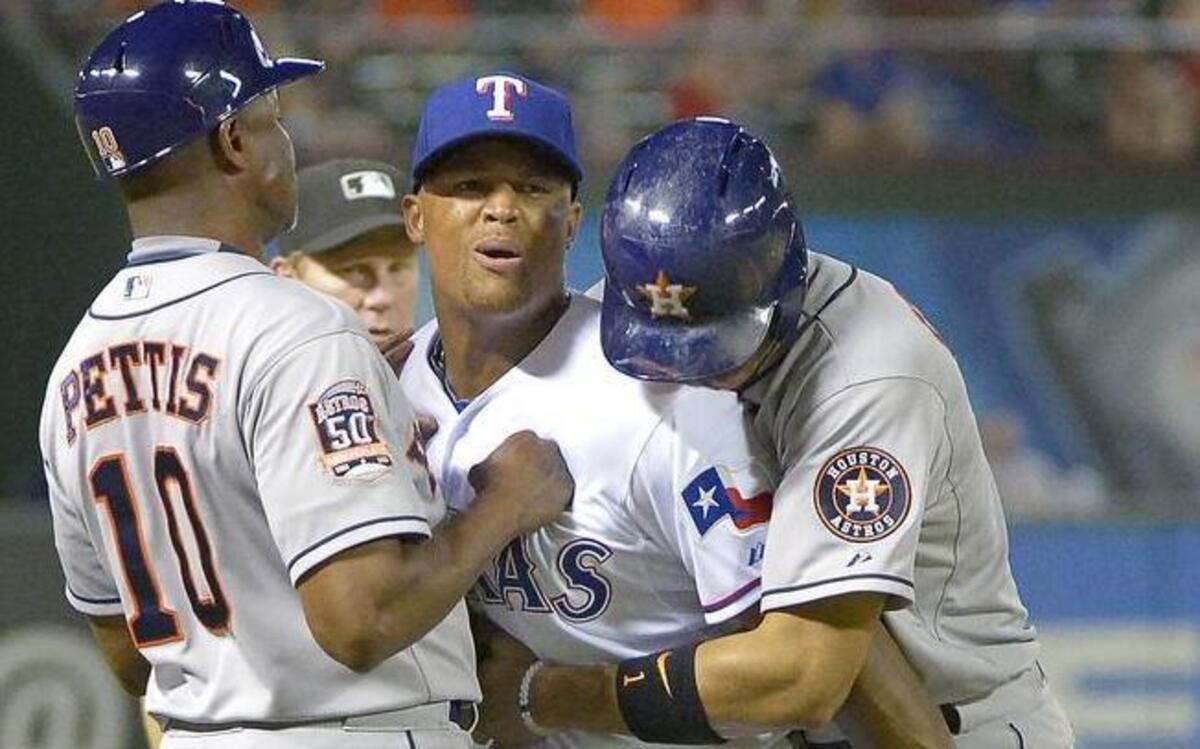 
Rangers third baseman Adrian Beltre gets caught between Astros third base coach Gary Pettis, left, and shortstop Carlos Correa after Correa tried to steal third on a foul ball. Texas beat Houston 4-3 Tuesday at Globe Life Park.
